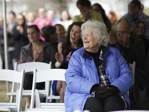 penny wilson, a woman with white hair wearing a blue jacket, laughing